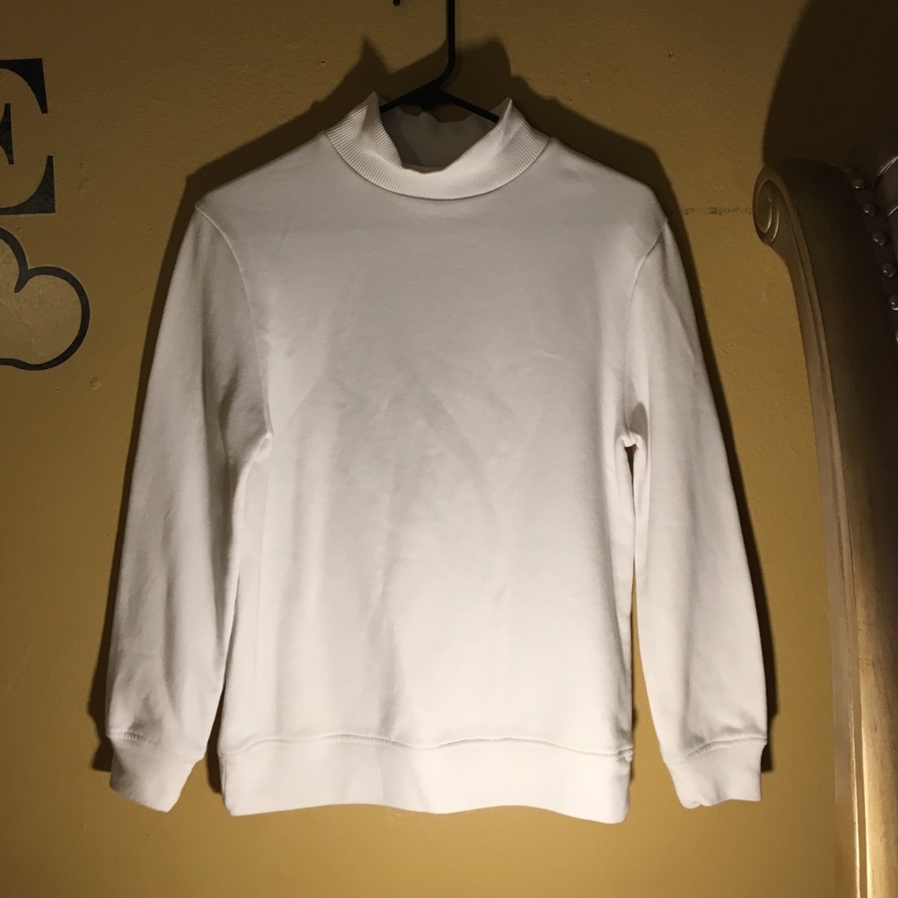 white turtle neck sweater with hole in back